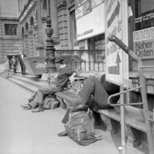 Travelers outside the main station of Zurich, 1956