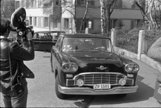 Journalists and photographers are waiting for the arrival of the family near Solzhenitsyn's home at