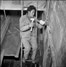 Tibetan man as construction worker, Waldstatt 1963