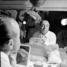 Heinz Rühmann putting make up on before entrance in 1951