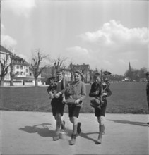 Boys collecting objects made of nonferrous metal; 1940