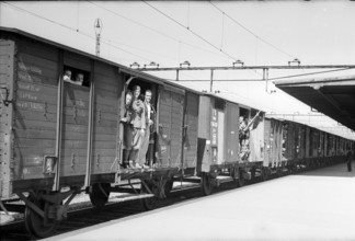 Internees leave Switzerland in a freight train; 1945