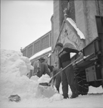 La ChauxdeFonds, man shoveling snow; 1952