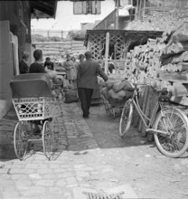 Delivery of fabric scraps for patchwork rugs, 1940