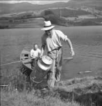 PontlaVille: Farmer brings milk can to cheese factory by boat; 1948