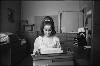 Secretary writing, 1969