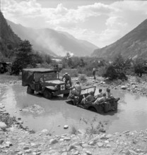 Female soldiers tow a Jeep out of a pond, Towing Brig 1950