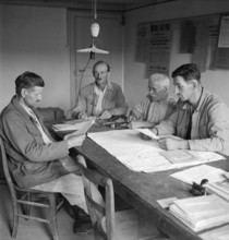 Champmartin, four men during a meeting