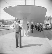 Man at tram stop Central, Zurich 1950
