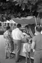 People at an ice cream stand; 1966
