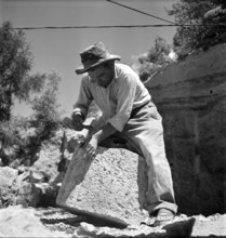 Workers in Saxon tuff quarry; 1947