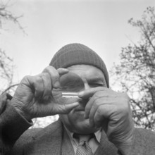 Ernst Glanzmann analyzes rock samples; 1954