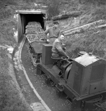 Mine, Herznach ore mine, mine cars leaving the tunnel; 1952