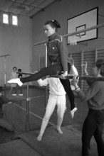 J+S leadership course: Girls doing parallel bars gymnastics, 1968