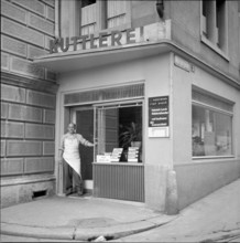 Butcher in front of a tripe shop in Zurich, 1956
