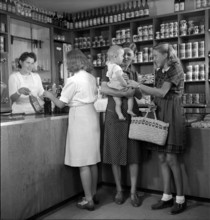 Saleswoman and customers in a grocery store, 1945