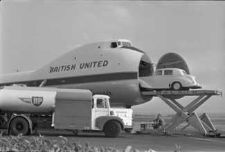 Rolls Royce being loaded onto an airplane, 1966