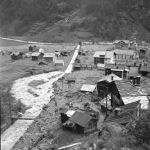 Devastation in the Valais village of Täsch after a debris flow; 1957