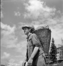 Farmer with freshly baked bread in St. Luc, Valais, 1941