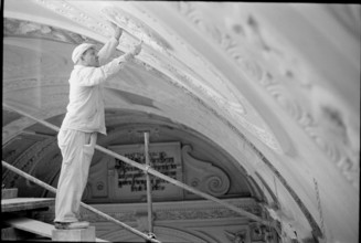 Stucco worker renovates the ceiling of the Predigerkirche Zurich 1966