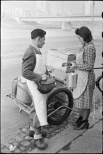 Milkman serving customer; 1941