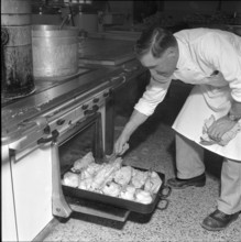 Grande Dixence, construction site cook at the oven 1957