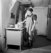 Farmer's wife cooking with electric cooker