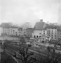 WW 2: bomb airdrop, dropping. burning houses, Schaffhausen 1944