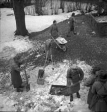 Women's reserve unit building road surface. cobblestone pavement. 1942