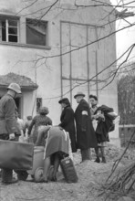 WW 2: Bomb airdrop, dropping. residents being evacuated, Basle 1945