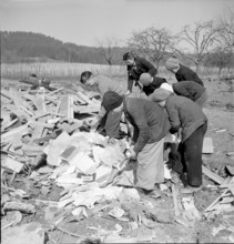 WW 2: bombing Rafz 1945. children, debris