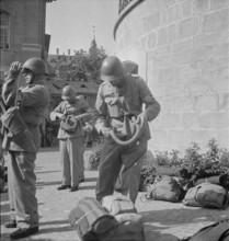 Call-up, soldiers assemble for service, gas mask. 1939