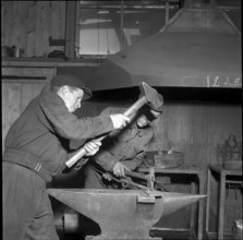 Blacksmith at the building site of Oberaar power station 1951