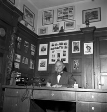 Davos: Woman, presumably in the office of the tourist office. 1949