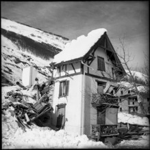 Vals, granary and pylon damaged by avalanche, 1951