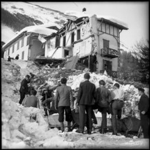 Avalanche in Vals, old man standing on the ruins of his home, 1951