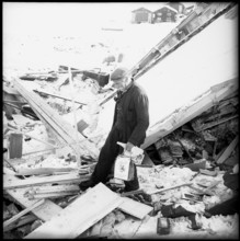 Avalanche in Vals, men listening radio news, 1951