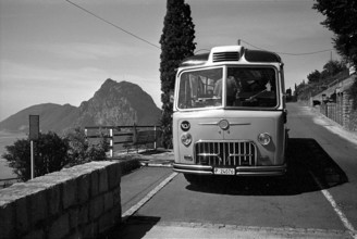 Lugano, Men buying ticket at ticket office, 1961
