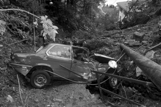 Flood in Ticino, Switzerland 1981: People watching at destructed house