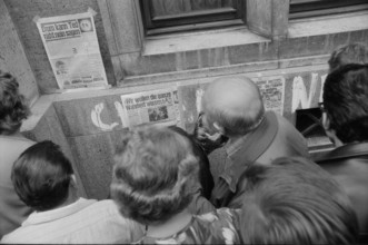 Prague 1968 after the invasion of the Warsaw Pact troops: Man filling up his car in front of the