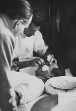 Spanish refugee with head injury, returning home, 1945