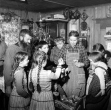Farmer's family celebrates Christmas; 1960