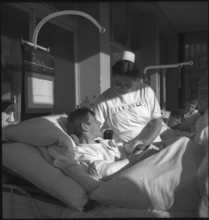 Nurse with patient in hospital 1943