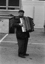 Street musician with accordion, 1968