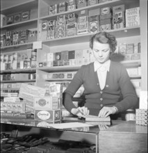 Davos, saleswoman in a tobacco shop; 1949