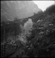 Landslide in the Maggia Valley; blasting to clear the road; 1950