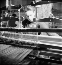 Woman weaving in a weaving room in Münstertal, 1946