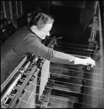 Embroiderer at work, 1945