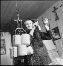 Woman weighing wool, 1945