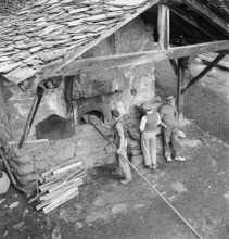 Baking bread in a Valais village, 1941